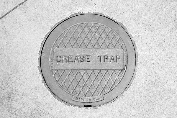 grease trap pumping involves removing the buildup of grease and waste from the trap and disposing of it responsibly